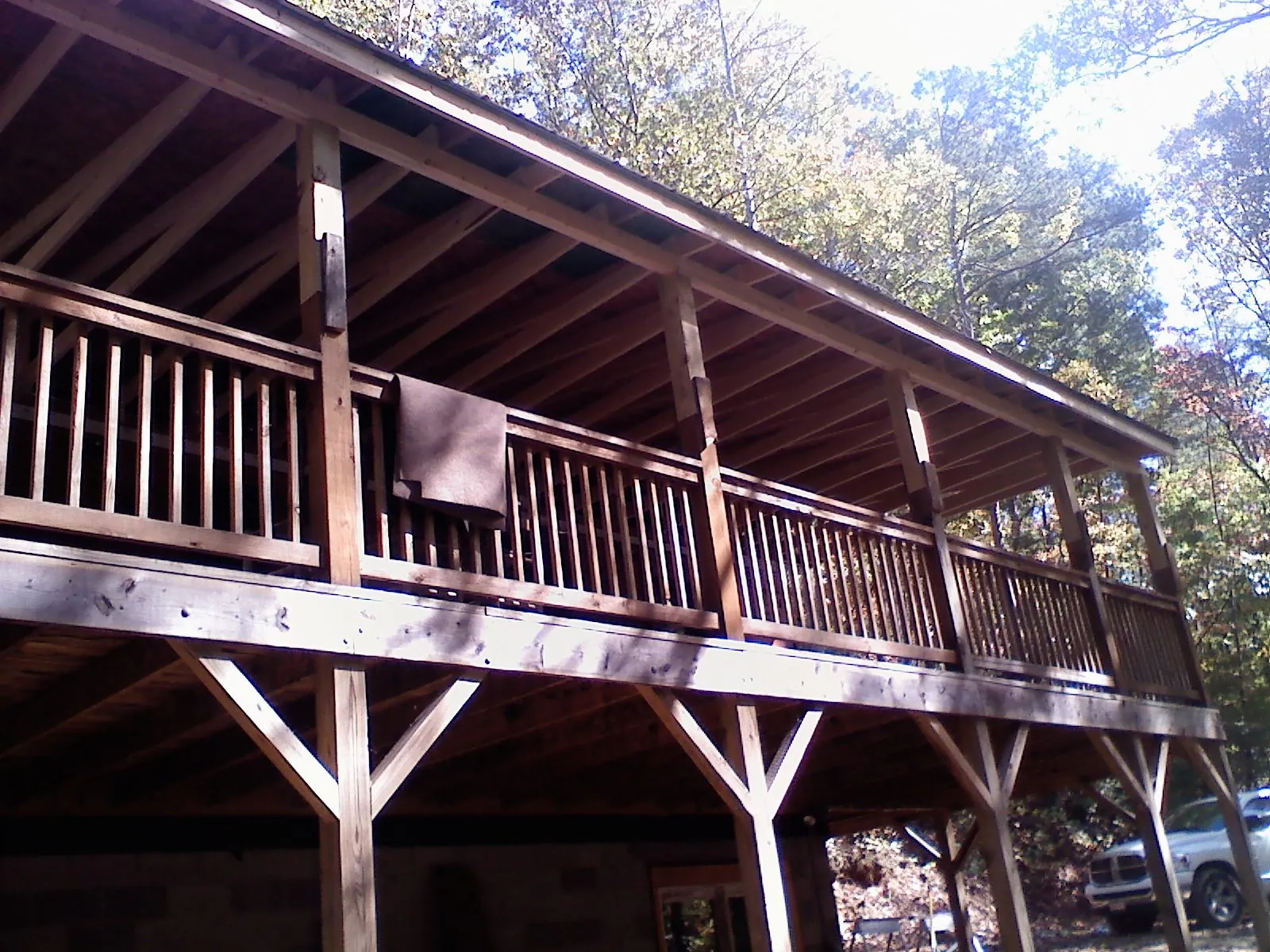 Timber framing under a new elevated porch and deck — Roof Leak Repair in Santa Claus by Roofing Brothers